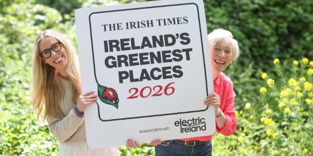 Two women holding the Irelands Greenest Places sign