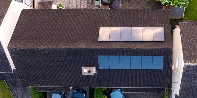 Birdseye view of home with solar panels on roof