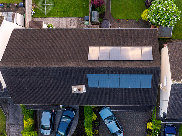 House from birds eye view with solar panels