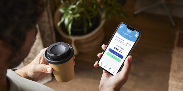 Electric Ireland Mobile App with a coffee