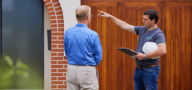 Retrofit specialist explaining benefits to a home owner